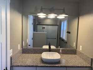 Shower, hair dryer, towels, toilet paper