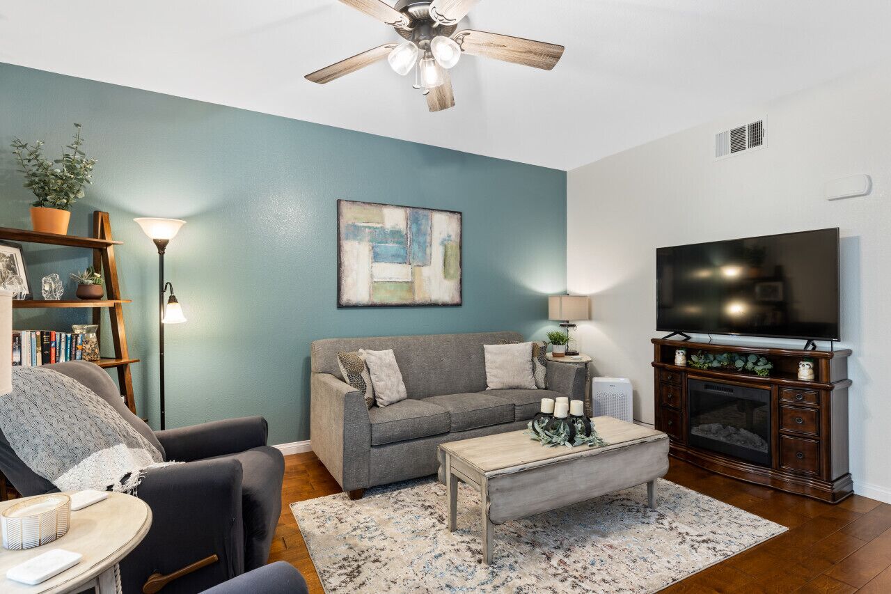 Cozy living room with streaming TV,  cable, fireplace, and sofa sleeper.