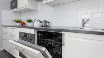 Apartment, 1 Bedroom, Balcony | Private kitchen | Microwave, dishwasher, cookware/dishes/utensils