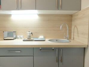 Fridge, microwave, coffee/tea maker, toaster