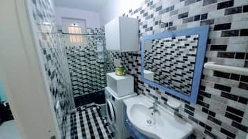 Shower, towels, toilet paper