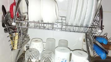 Fridge, electric kettle, cookware/dishes/utensils, dining tables