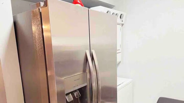 A stainless steel refrigerator with a water dispenser and a freezer compartment. - Fuseball & Games - 2 BD / 2 BTH Condo Miami! (Miami)