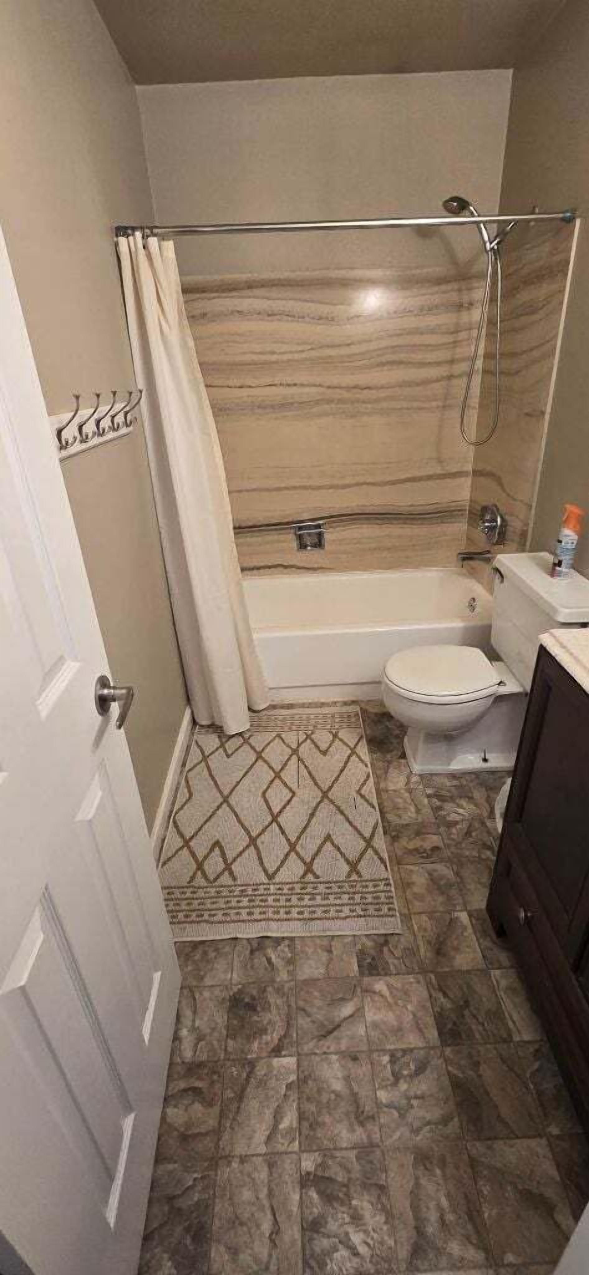 Combined shower/tub, hair dryer, towels, soap