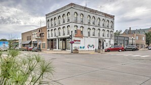 A historic building with a casino sign, large windows, and a street view with parked cars. - Modern Yankton Apartment Near Riverside Park! (Yankton)