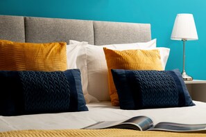 Relax in comfort with a plush bed, soft pillows, and a warm reading nook.