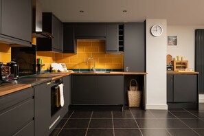 Enjoy cooking in this well-lit kitchen with a central island and oven.