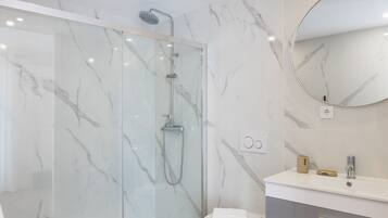 Shower, hair dryer, towels, soap