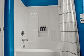 Combined shower/tub, hair dryer, towels - Enjoy Poolside Perks in This Charming Home, Just Minutes from Town (Port Aransas)
