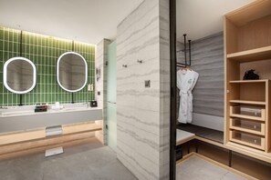 A modern bathroom with a vanity, two mirrors, a towel rack, and a wooden storage unit.