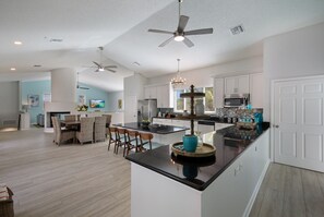 Fridge, microwave, oven, stovetop - Island Pineapple: 5 min to Beach, Screened Pool, Waterfalls, Game Room by Anna Maria Life (Holmes Beach)