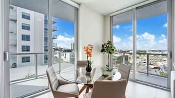 1 Bedroom with Balcony | Living area | 55-inch Smart TV with digital channels, TV