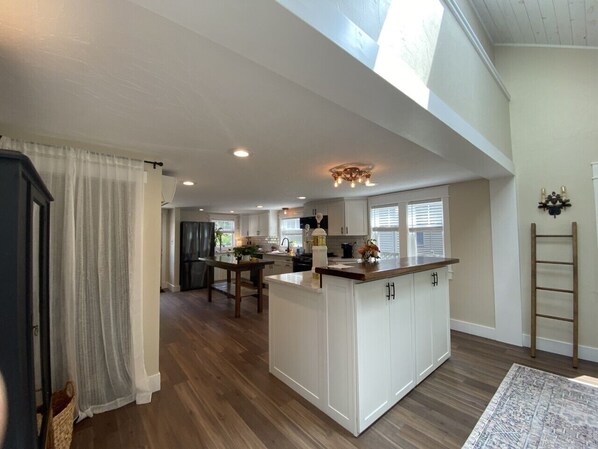Enjoy cooking in this well-equipped kitchen with a central island and ample counter space.