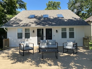 Enjoy a peaceful retreat with a front deck offering a seating area for relaxation or dining.