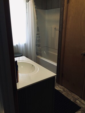 Combined shower/tub