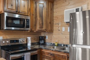 Fridge, microwave, stovetop, coffee/tea maker