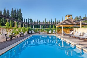 A swimming pool with lounge chairs, a pergola, and a gazebo. - The Lodge at Healdsburg, Tapestry Collection by Hilton (Healdsburg)