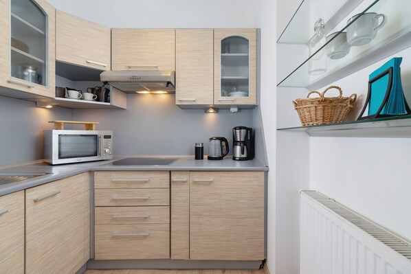 Microwave, coffee/tea maker, cookware/dishes/utensils