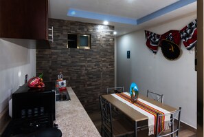 Deluxe Room | Private kitchen | Fridge, microwave