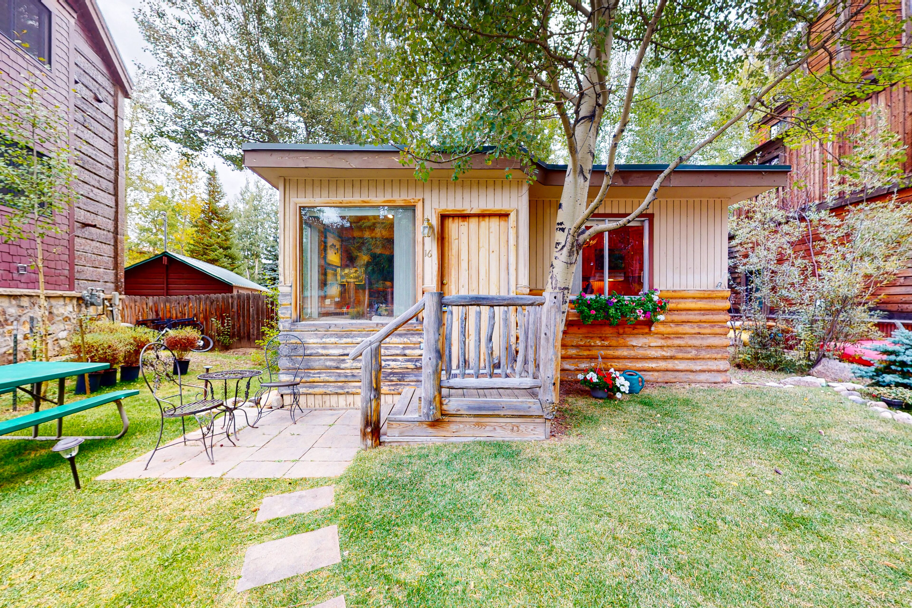 Rustic lakefront cabin with dock, sand beach, playground, grills, picnic area