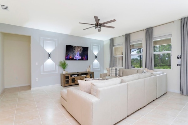 Open living space that seamlessly connects the beautiful kitchen and dining area, offering a perfect blend of comfort and style. You could enjoy a Smart TV and feel just like home!