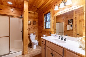 Bathtub, towels, soap, shampoo