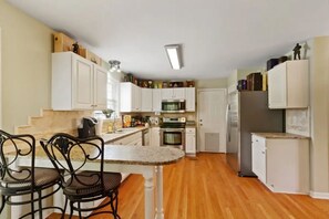 Enjoy cooking and dining in this well-equipped kitchen with a dining area for two.