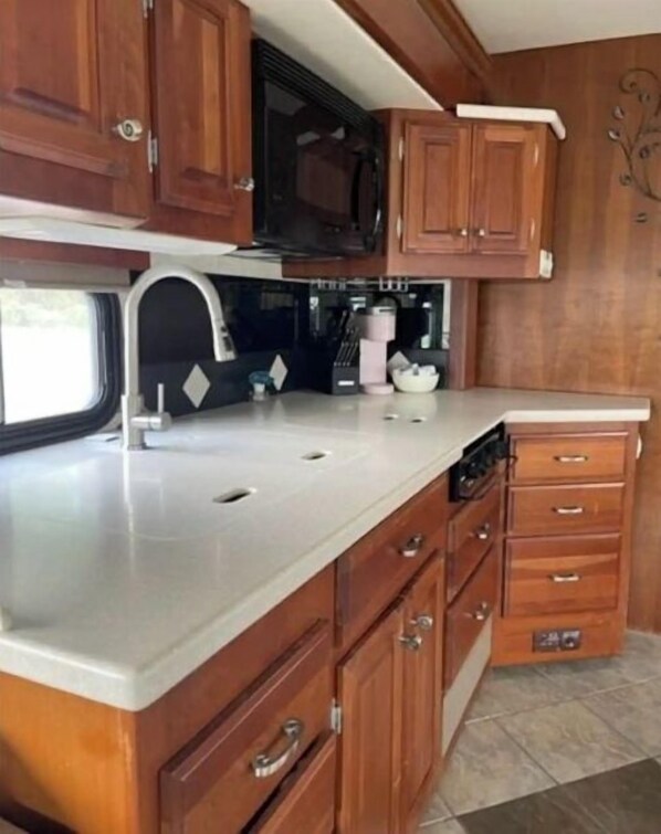 Fridge, microwave, stovetop, coffee/tea maker