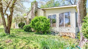 A single-story house with a front porch, a large window, and a well-maintained lawn. - Calm Country Oasis - Creek, ATV Trls & Norris Lake (Speedwell)