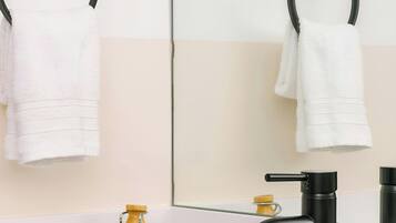 Designer toiletries, hair dryer, towels, soap