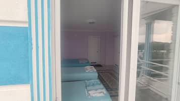 Family Quadruple Room, Multiple Beds, Balcony, Lake View | Premium bedding, individually decorated, individually furnished, desk