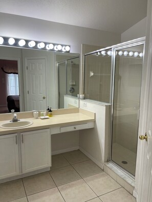 Combined shower/tub, hair dryer, towels, soap