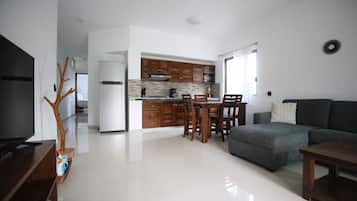 Habitación Confort | Área de sala de estar | Televisión LED, Netflix y servicios de streaming