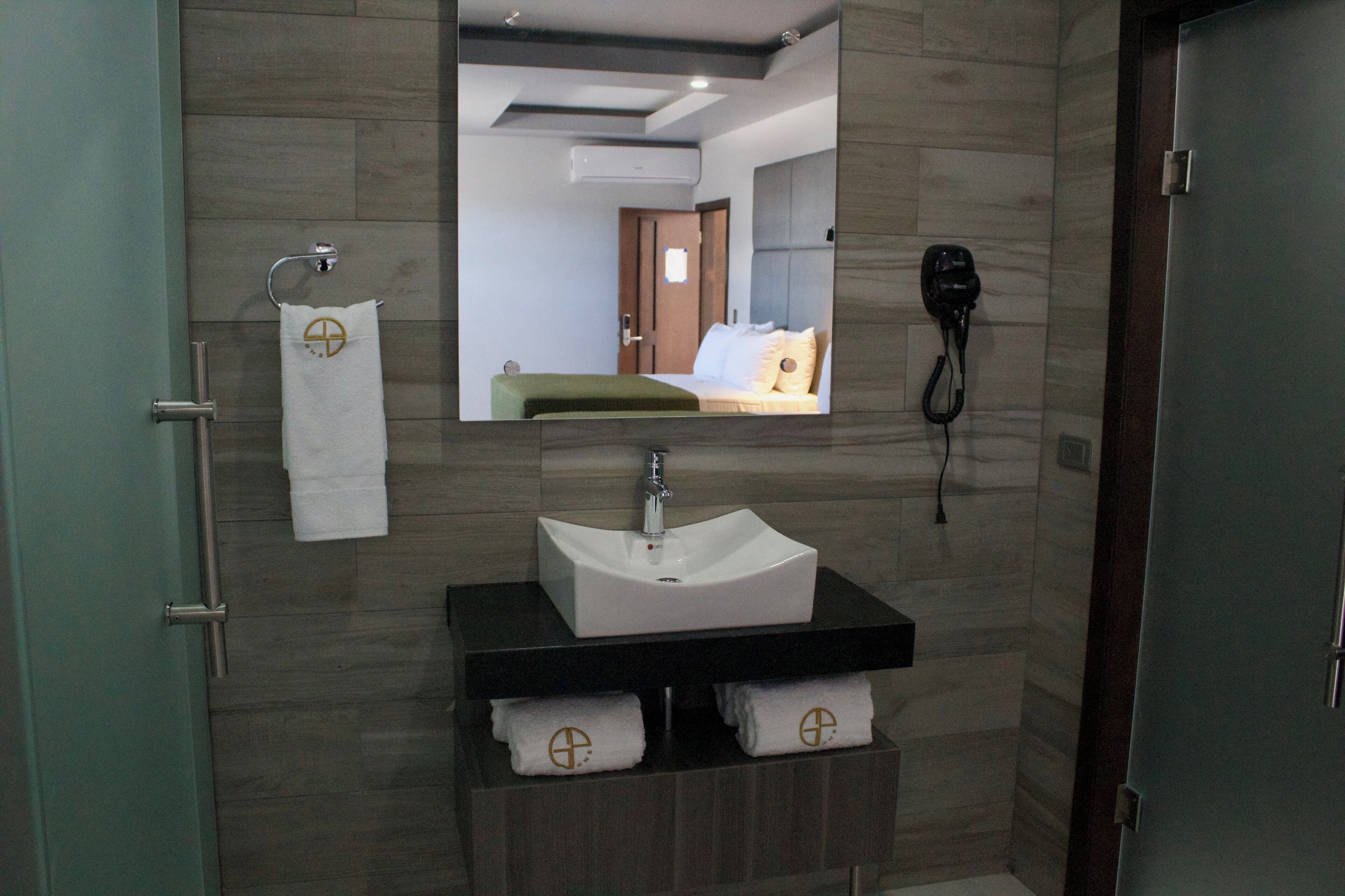 shower, rainfall showerhead, hair dryer, towels