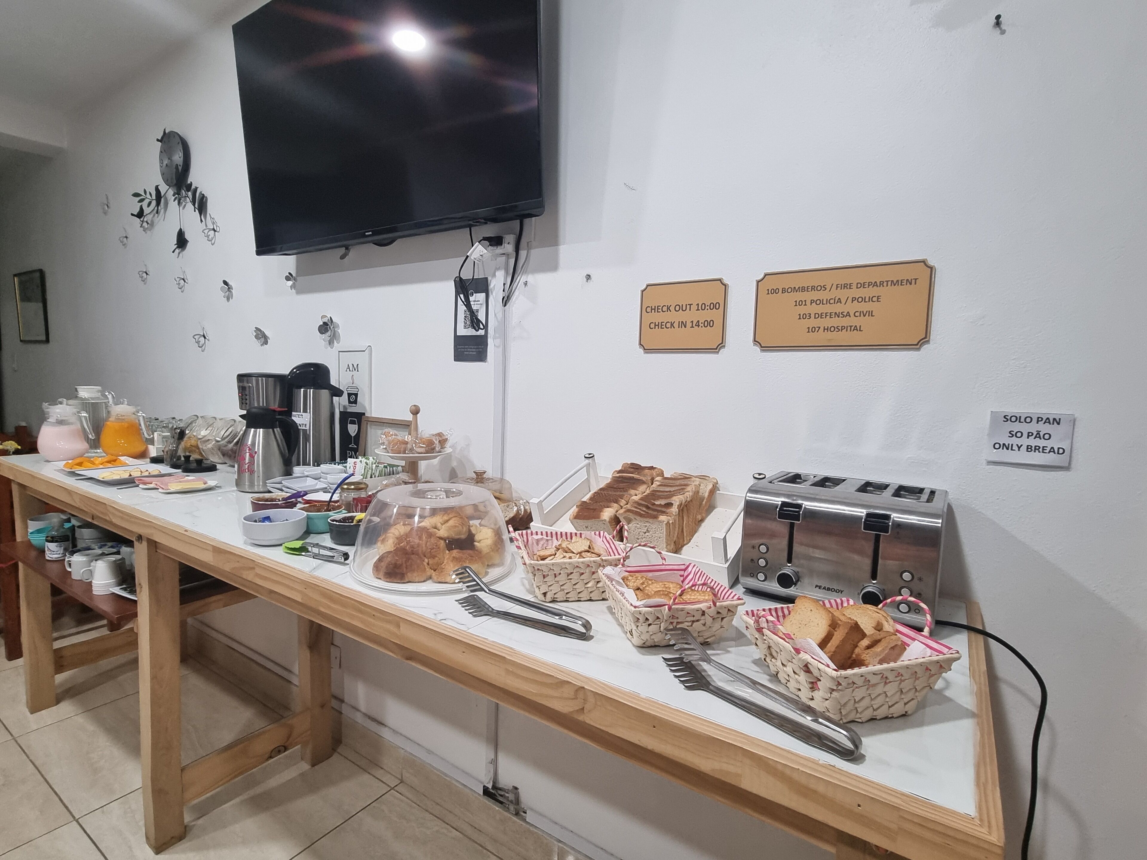 A breakfast buffet with various food items and a toaster.