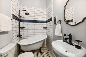 Bathtub, hair dryer, towels, soap