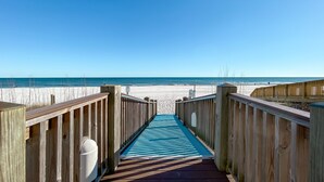 A wooden boardwalk leading to a beach with a clear blue sky. - Summerchase 304- Family Friendly Fun Beach Getaway!! (Orange Beach)