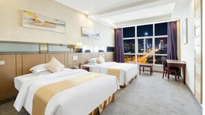 A hotel room with two beds, a desk, a chair, and a large window with a city view. - Zhongshan Union Hotel (Zhongshan)