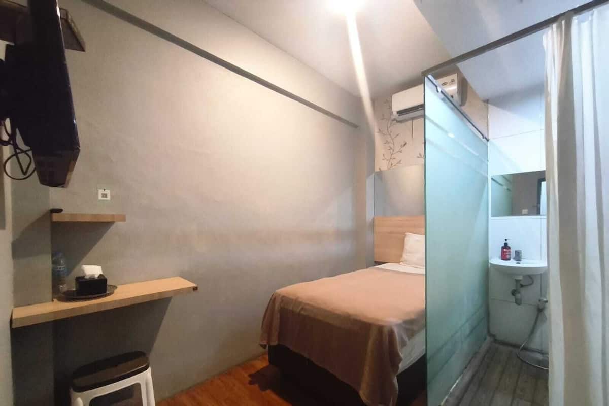 Habitación individual Deluxe | Escritorio, wifi gratis y ropa de cama 