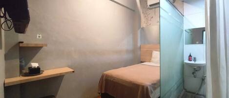 Habitación individual Deluxe | Escritorio, wifi gratis y ropa de cama