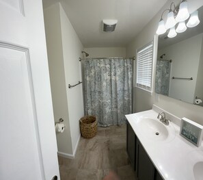 Combined shower/tub, hair dryer, towels, soap