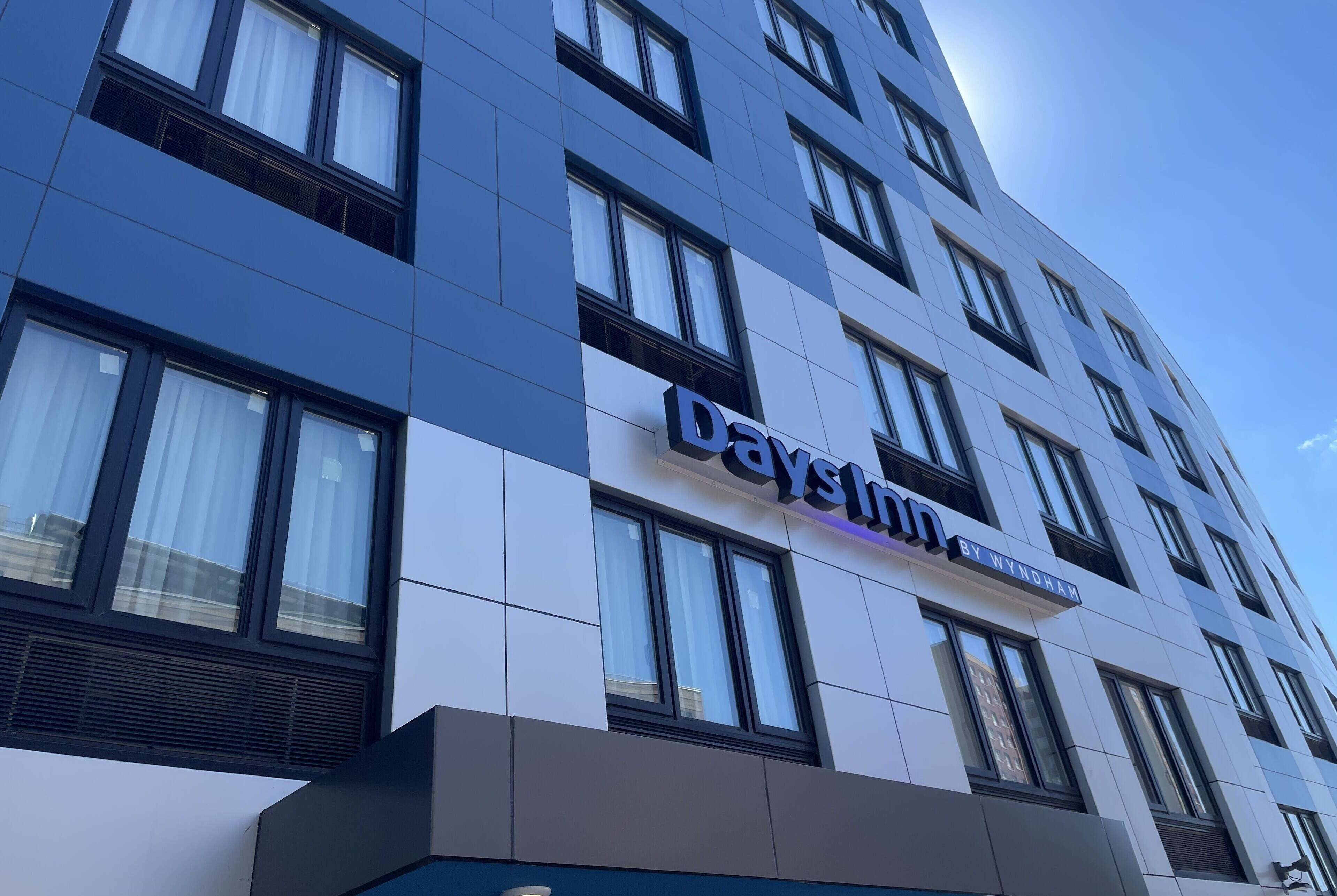 A modern building with the sign "Daystays by Wyndham."