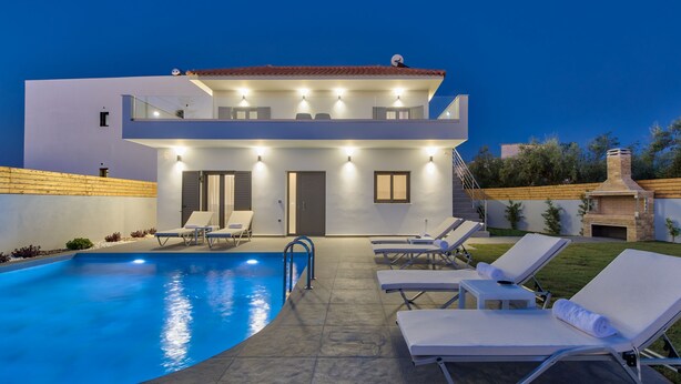 A modern two-story house with a swimming pool, sun loungers, and a barbecue area. - Villa Agalliu (Zakynthos)