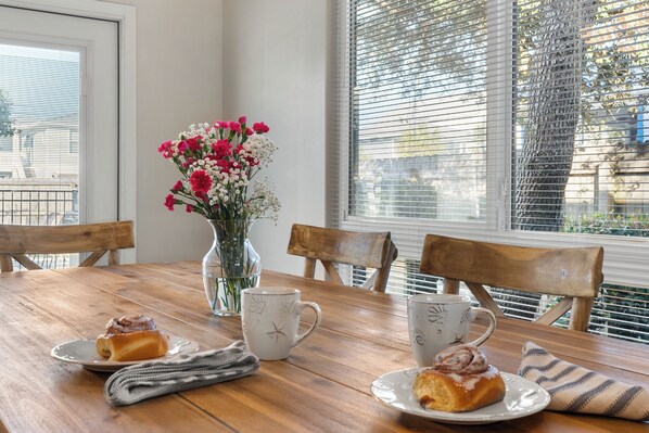 Enjoy a romantic breakfast for two by the window, with a beautifully set table and fresh flowers.
