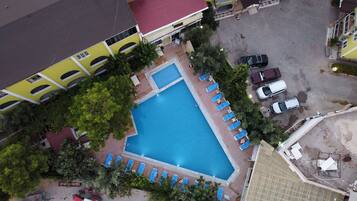Indoor pool, seasonal outdoor pool, pool umbrellas, sun loungers