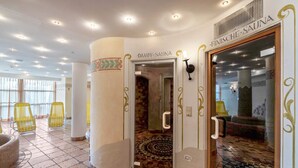 A spa area with a tiled floor, a glass door entrance, and a sign reading 'FINISCHE SAUNA.' - 'Residence Diana Apartment 301' with Mountain View, Balcony & Wi-Fi (Terenten)