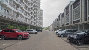 A multi-story residential building with a parking area in front. - S&A Property 4 (Citaringgul)