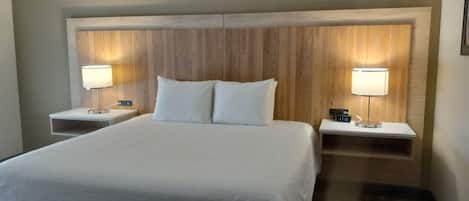 Desk, laptop workspace, blackout drapes, iron/ironing board