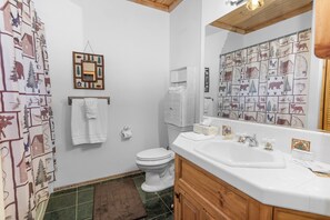 Combined shower/bathtub, towels, soap