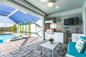 Relax in a serene outdoor oasis with a pool, patio, and comfortable seating area.